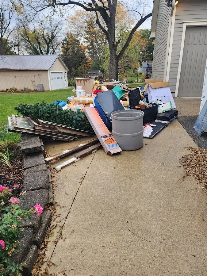 Dumpster being loaded with debris for 10 Yard Dumpster Rental in Corning